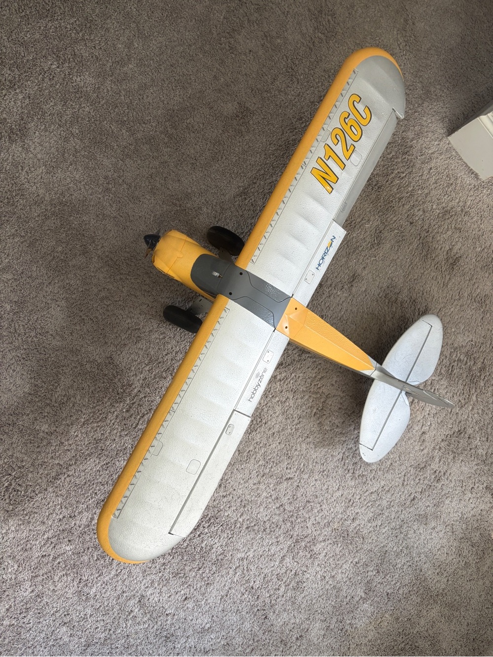 Remote - control airplane for novice to advanced flyers bright yewllow and white